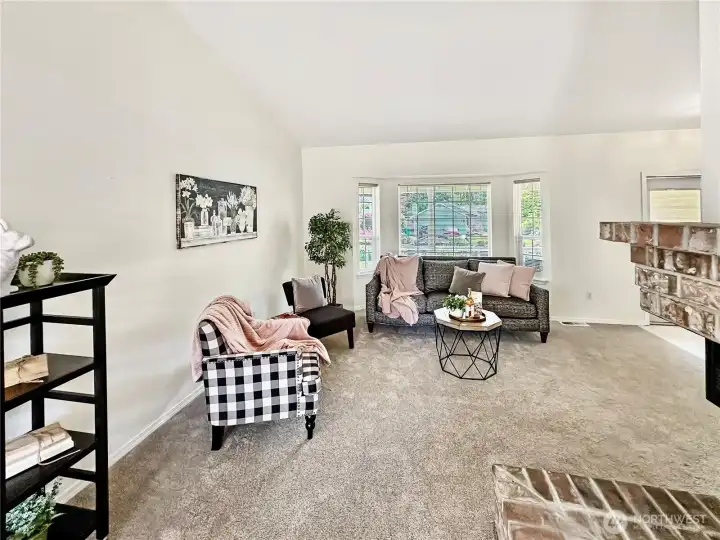 Another view of the living room bay window offering lots of  nature light.