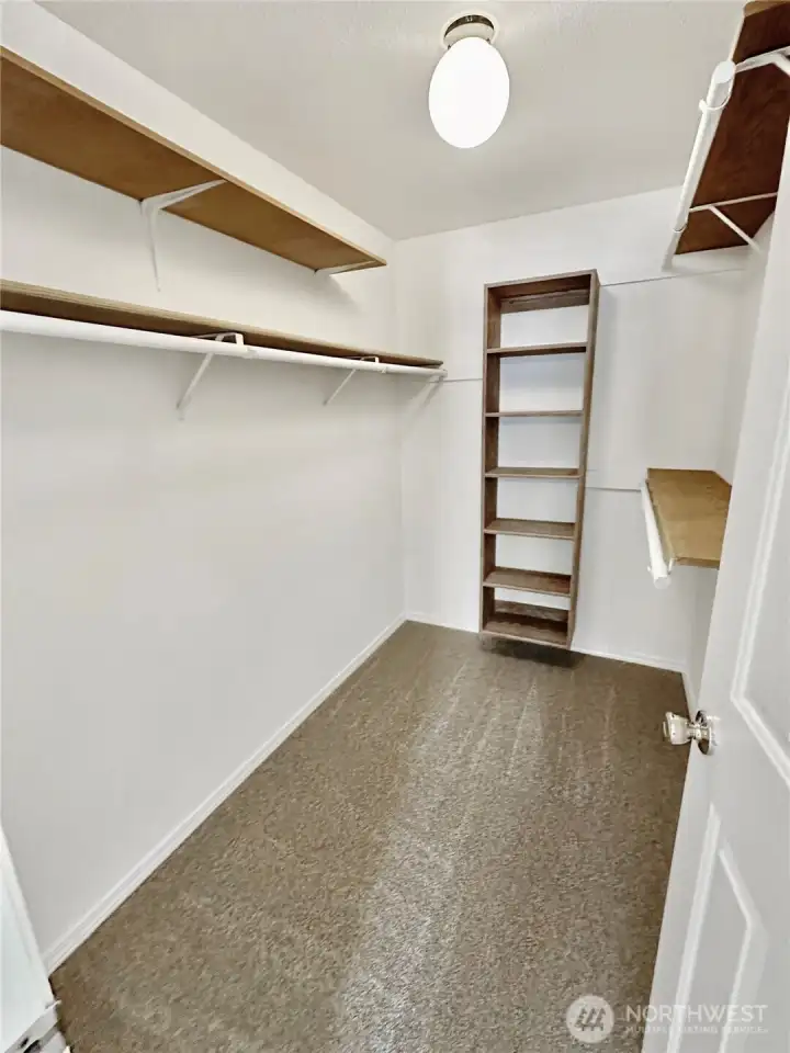 Primary walk-in closet.