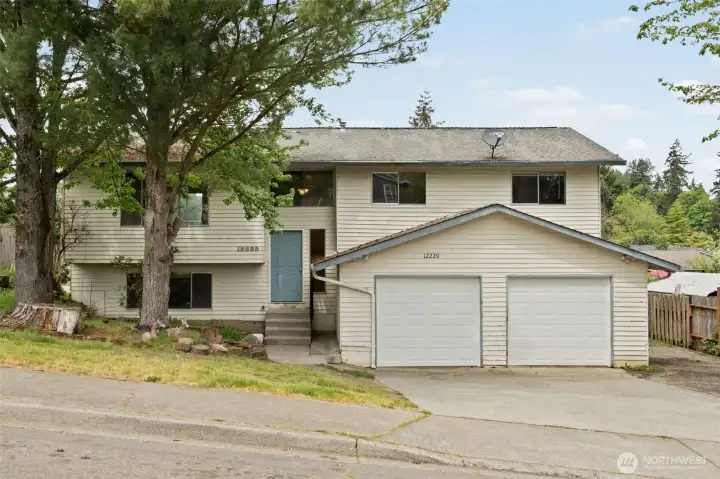 Solid structure, two-car garage, and a quiet Kent street — the bones are here, the upside is yours. Cosmetic updates in this market = instant equity. Off-street parking on the side.