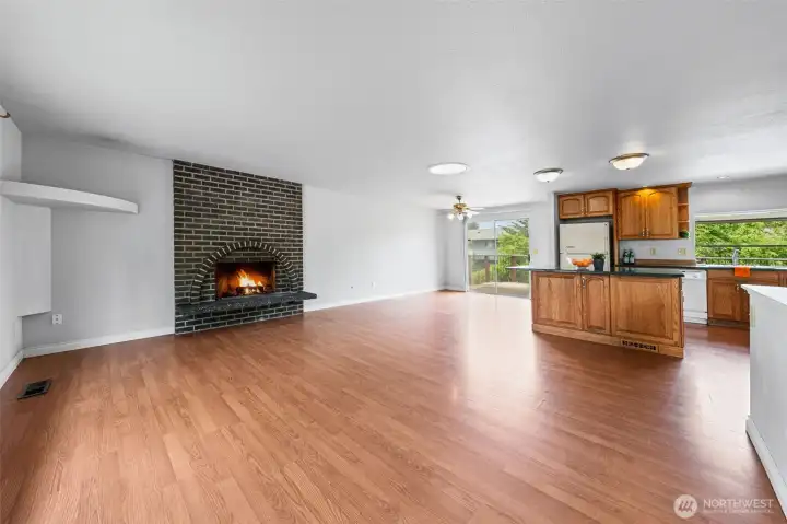 Great room concept layout will attract future residents after updates are made. Fireplace anchors the living room, open flow into the kitchen, and a sliding glass door leads straight to the deck. Room for dinner parties, movie nights, and everything in between.