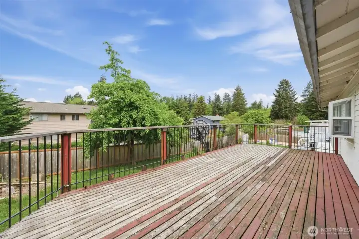 Thirty foot long deck will lure the next owner's in. This is the entertainment space is right off your kitchen.