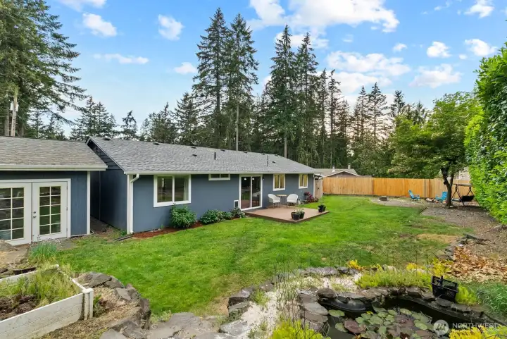 Back yard and shop access , garden space and koy pond