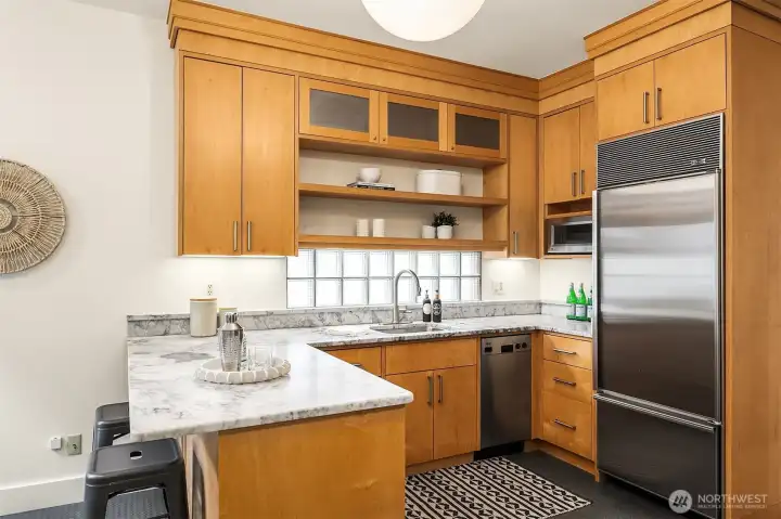 With slab countertops, and custom wood cabinetry.