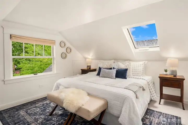 Upstairs bedroom is drenched with light.