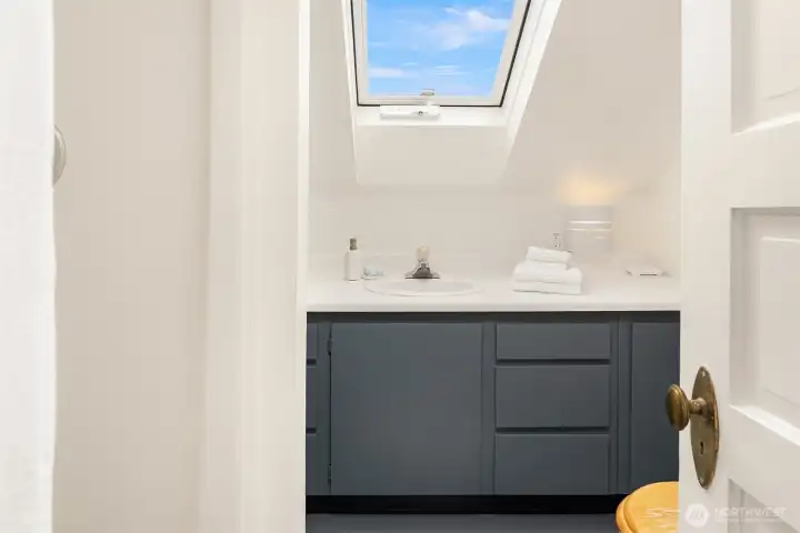 Upstairs bathroom with skylight.