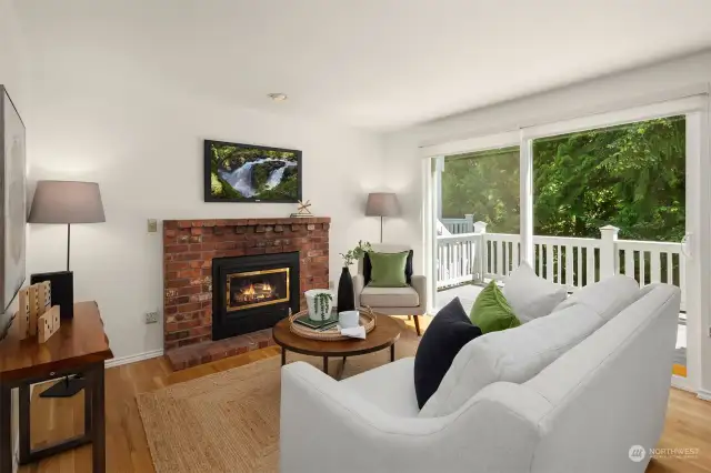 Family room features a slider that leads out to the greenbelt.