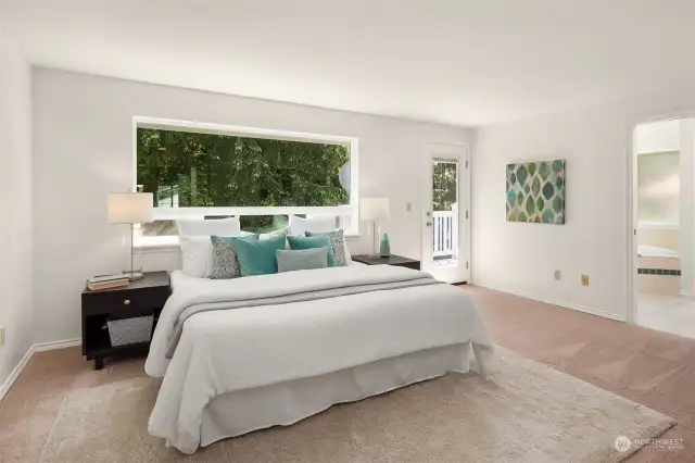 Primary bedroom upstairs complete with a balcony that overlooks the greenbelt.