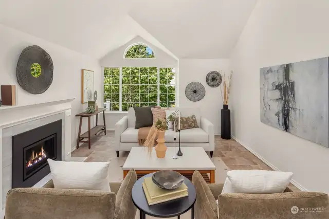 Livingroom features a gas fireplace and an oversized West facing window.