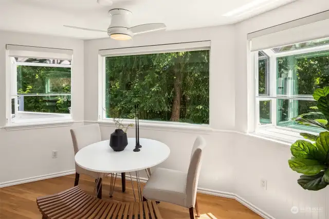 Large bay window looking out to the greenbelt.