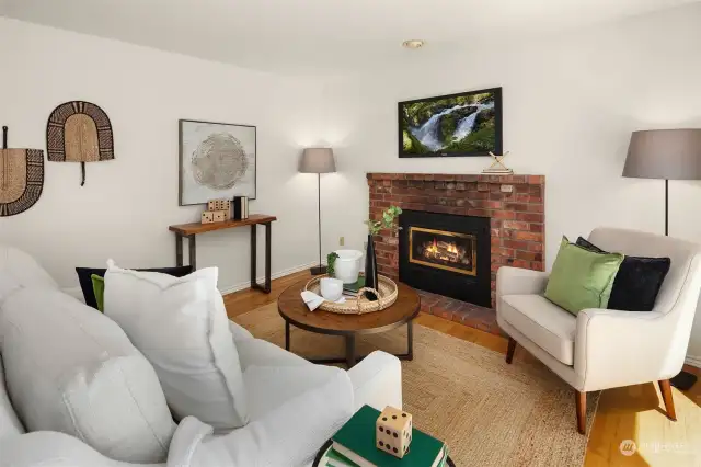 Gas fireplace and hardwood flooring.