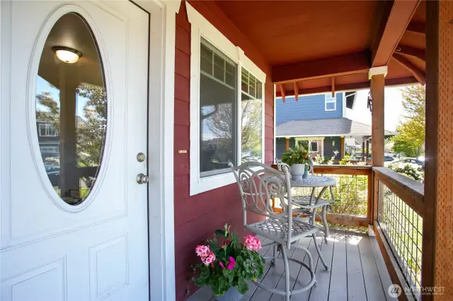 Welcome guests with charm and warmth on this inviting front porch—perfect for enjoying your morning coffee or watching the neighborhood go by.