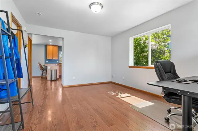 Step into this freshly painted flex space—currently set up as a home office, but easily adaptable as a cozy second living room, creative studio, or play area.