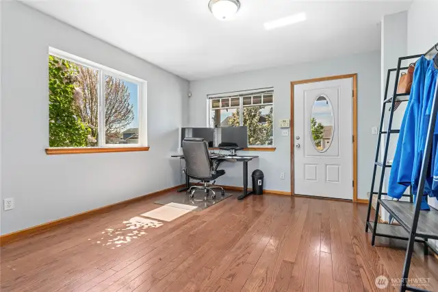 Step into this freshly painted flex space—currently set up as a home office, but easily adaptable as a cozy second living room, creative studio, or play area.