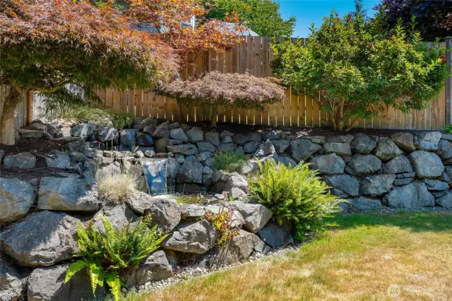 Waterfall in left corner of the yard