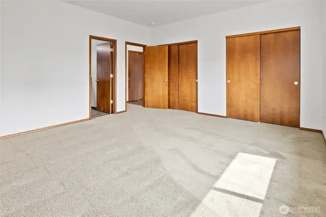 Two closets in primary bedroom.