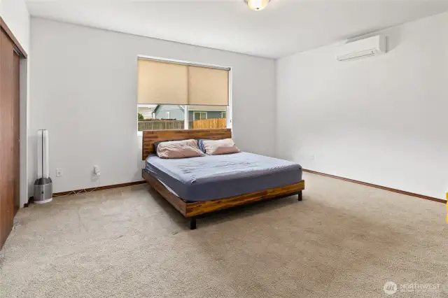 The spacious primary bedroom is just one of the highlights of this property.