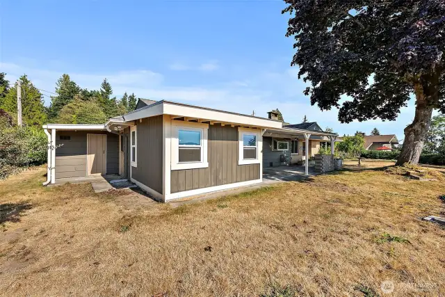 Large and long backyard, full of space to garden, entertain and enjoy the views. Attached storage shed/shop off garage.
