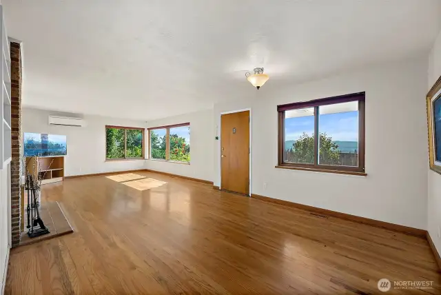 Natural Light flows in abudance into this open layout for living room and dining space