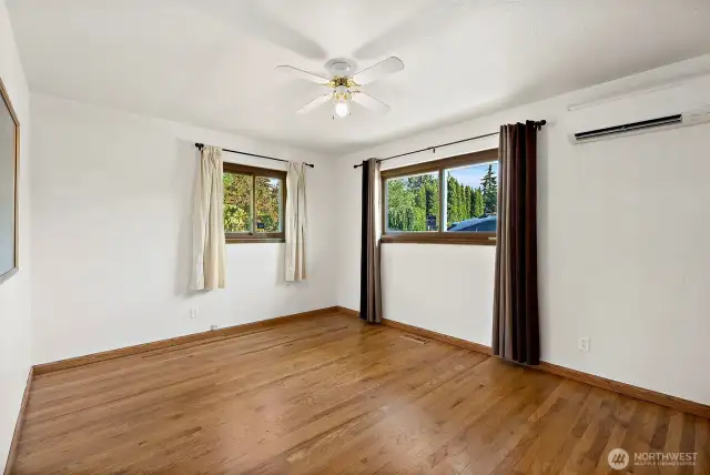 Original primary turned into 2nd bedroom with 2 windows bringing in lots of natural light and ceiling fan and mini-split to keep the perfect tempature all year long.