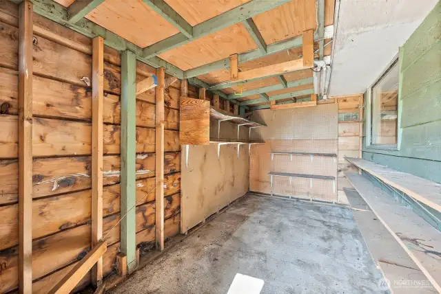 Interior of attached storage shed/shop off garage