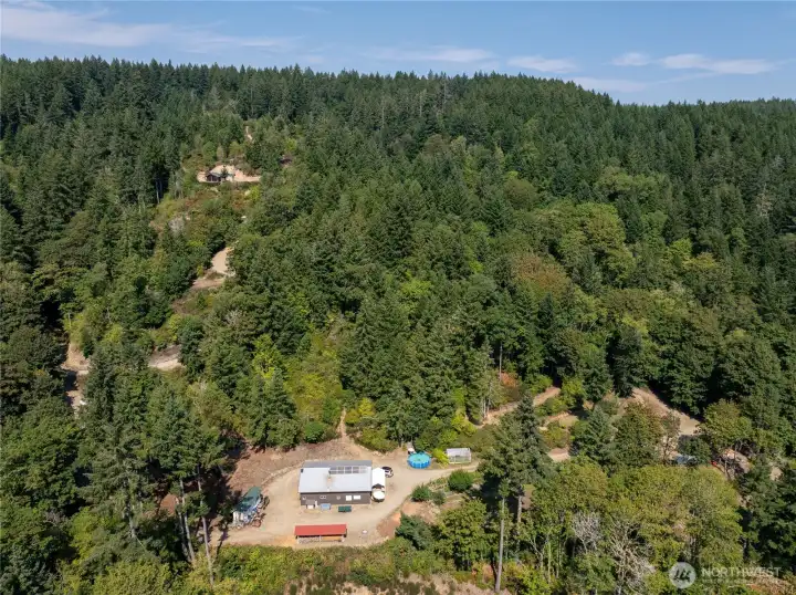 Rare South facing acreage - split into seven 5-acre parcels with shop, woodshed, gardens, sawmill, cabins, and campsites. Not to mention Hood Canal Views from SO many spots!