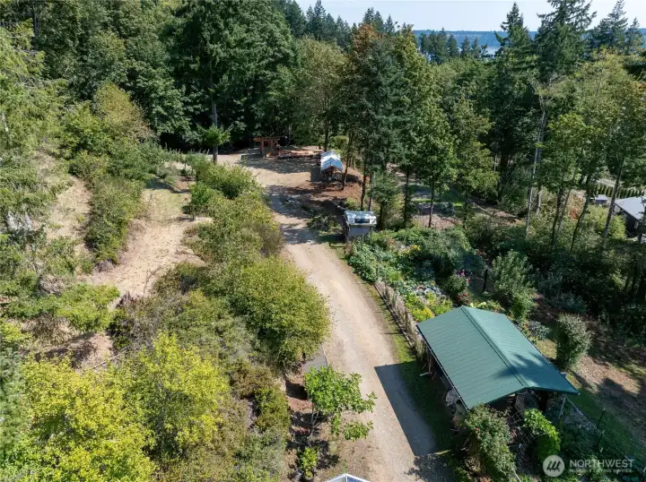 Facing East towards the gardens, sawmill area, and orchard. Lots of flat areas to choose from for building dream homes! Each lot has a great spot to build! So many choices!