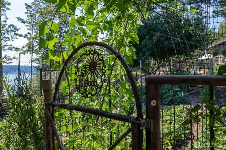Hand-crafted features throughout the property, including the garden gates and arches.