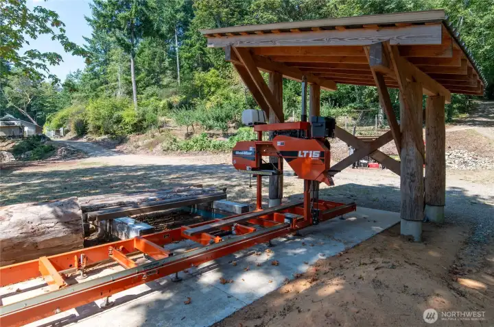 This is THE MACHINE! It has been used to create many of the structures on this property, using wood that was sustainably harvested right here! Sawmill is negotiable.