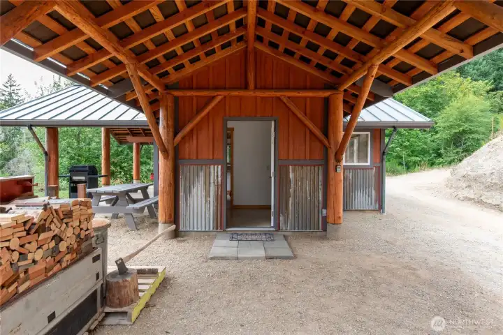 Covered entrance into the cabin.