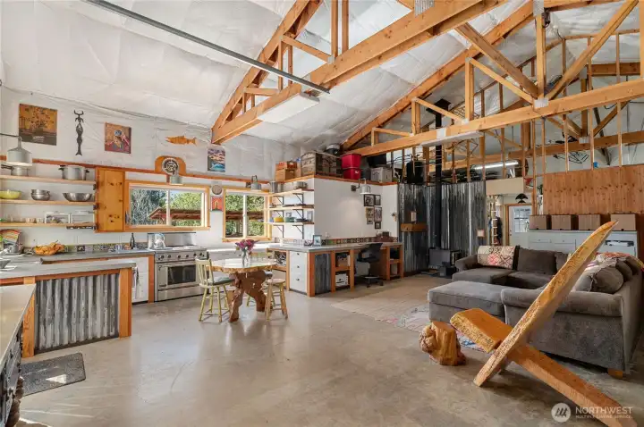 This is the interior of the shop on the kitchen and office side. There is PLENTY of room for an RV and boat and other toys. This is called The Adventure Hub!