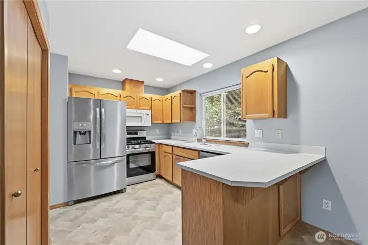 Well-kept kitchen with plenty of cabinet and counter space.