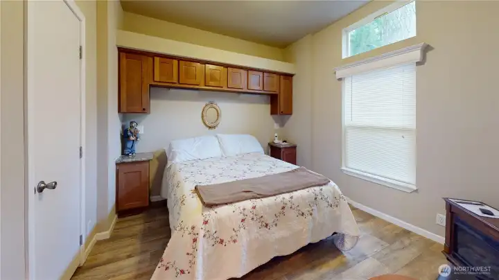 The bedroom features a good size closet, easy access to the bathroom and an electric fireplace.