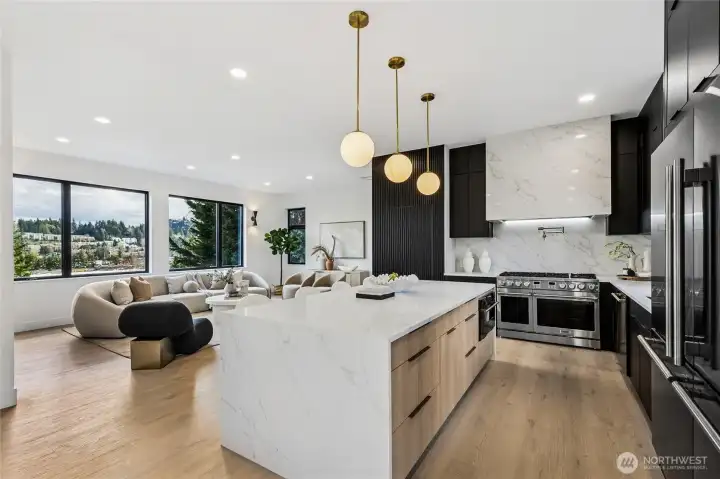 Modern Chef's Kitchen open to the living room and City View