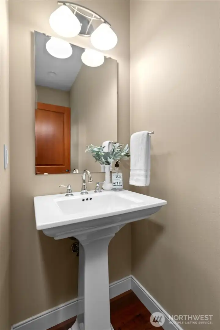 Half bath with clean finishes and functional layout.