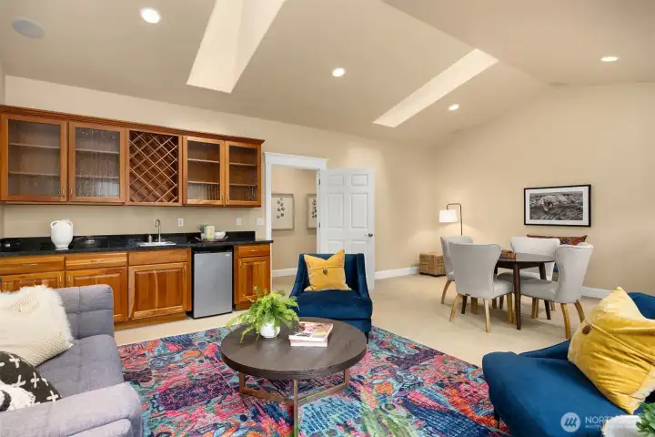 Second floor media/bonus room is fantastic, with vaulted ceilings, skylights, built-in cabinetry, sink and under-counter refrigerator.