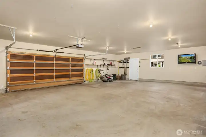 Inside the detached garage. Not shown: heater suspended from ceiling in back right corner.