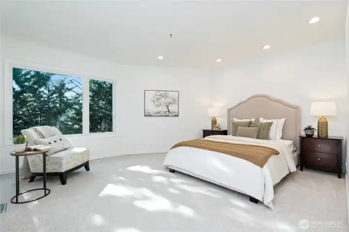 Oversized primary bedroom with walk in closet and bath