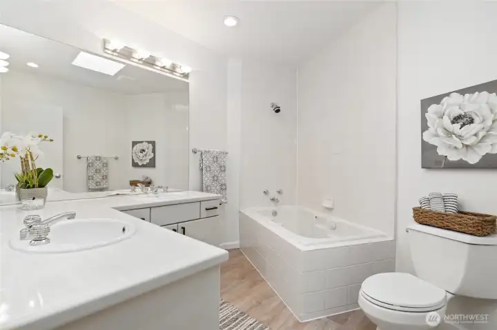 Primary bath with new flooring and new toilet