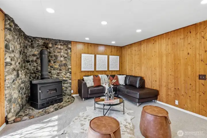 Wood burning wood stove with river rock surround