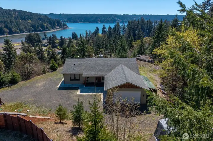 Perched above Hood Canal, this home enjoys a breathtaking “bird’s-eye” view of the water and forested shoreline—your own private retreat with a front-row seat to the Pacific Northwest.