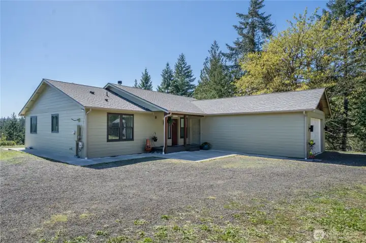 Crisp, well-maintained curb appeal with an easy approach, generous parking, and an attached two-car garage—welcome home to your private hilltop retreat.