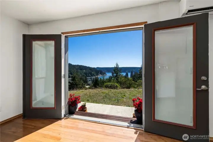 Double French doors open to fresh air and postcard views—step outside and take in Hood Canal and the peninsula right from your living space.
