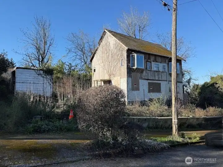 Value in the Land - Home abandoned, boarded and secured.