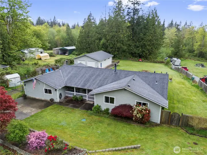 Rambler styled home with huge 2 bay shop on 2.5 acres.