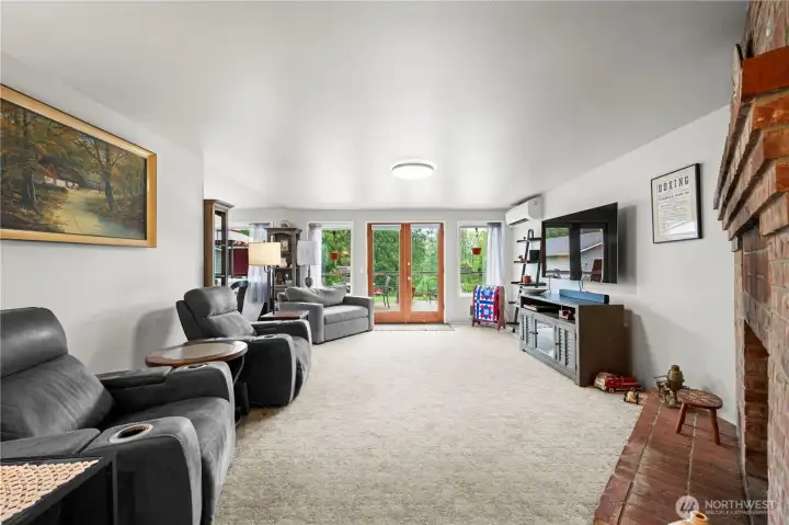 Open and spacious living area, with cozy gas fireplace.