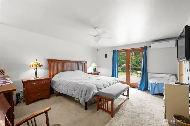 Enjoy the primary bedroom that has french doors opening up to the back deck area.
