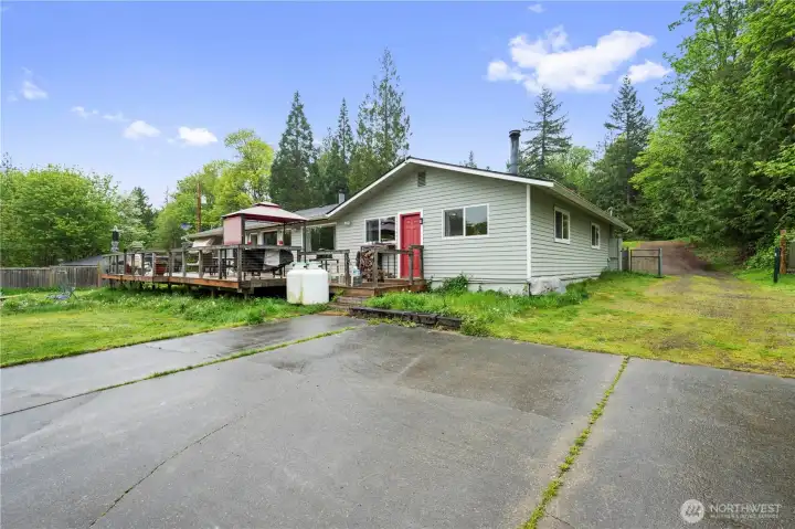 Looking from the shop to the back of the house & deck area.