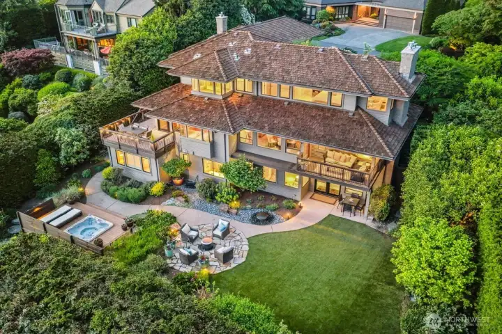 If you lived here, you’d find there are so many ways to enjoy the outdoors without leaving the comfort of home, whether it’s taking in the views from one of the two decks, relaxing in the hot tub, gathering around the fire pit, or starting up a game in the lawn area.