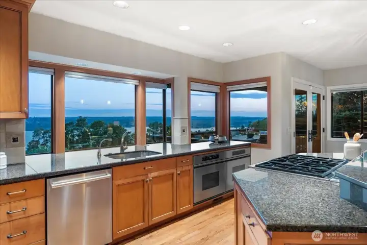 Preparing meals feels anything but routine in this beautiful kitchen, where stunning views from the kitchen window greet you from every angle.