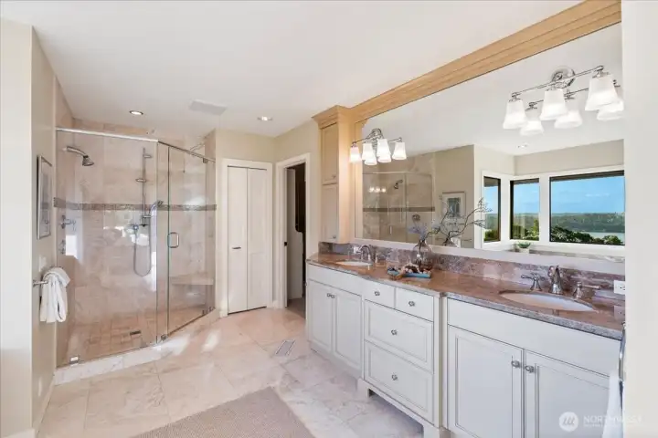 Even through the mirrors, you can take in the views from all angles of this primary bedroom suite.